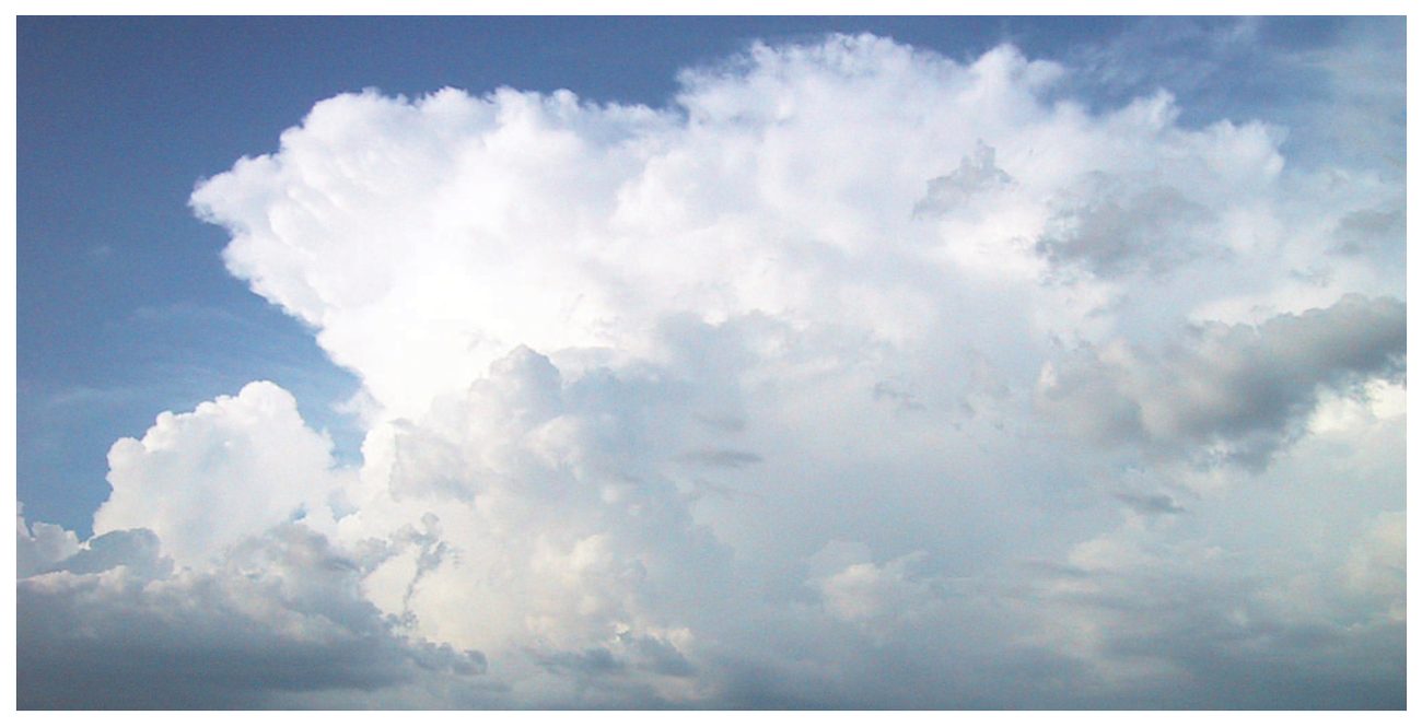 Photograph of a large cumulonimbus with an anvil top.