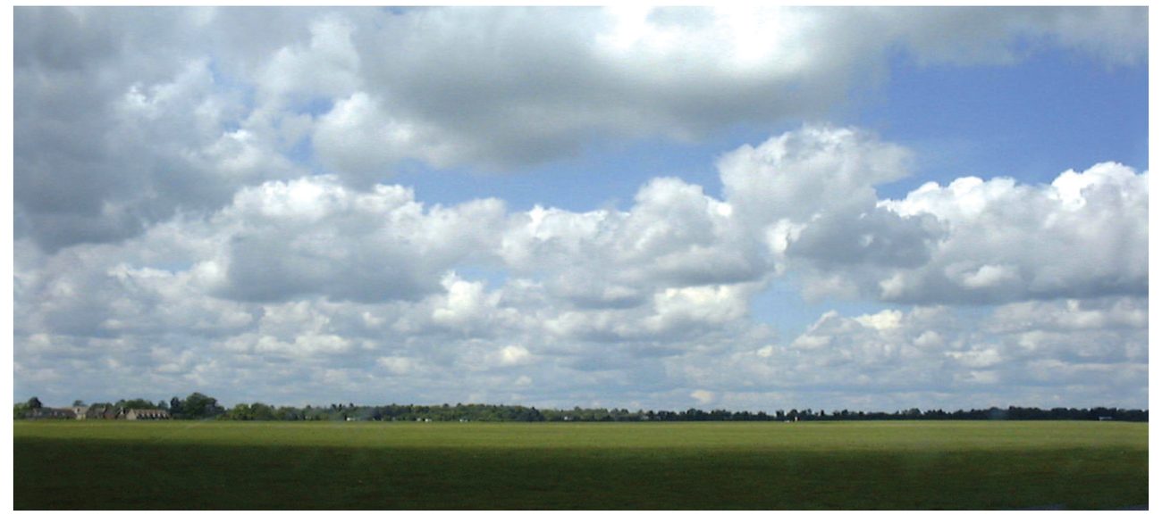 Photograph of fair weather cumulus over flat country.